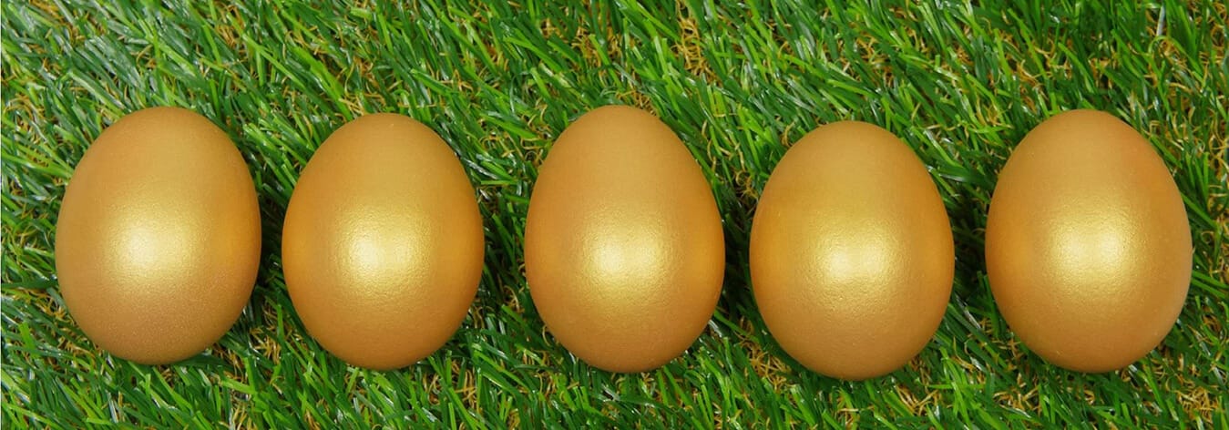 Golden eggs on grass